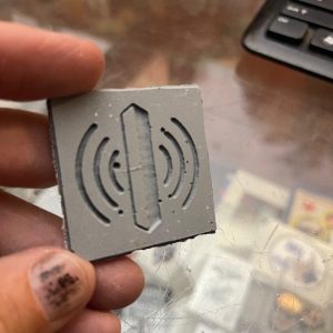 3D printed square tile with wireless signal icon